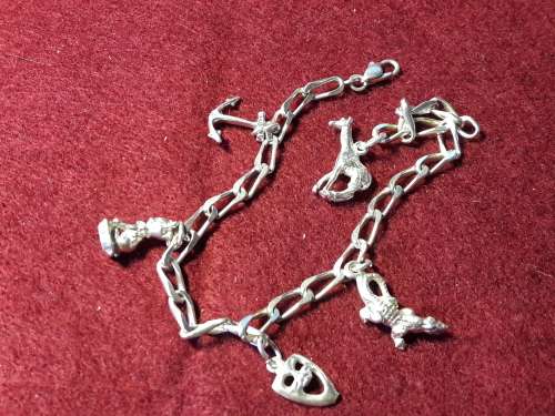 SOLID STERLING SILVER BRACELET WITH 5 CHARMS