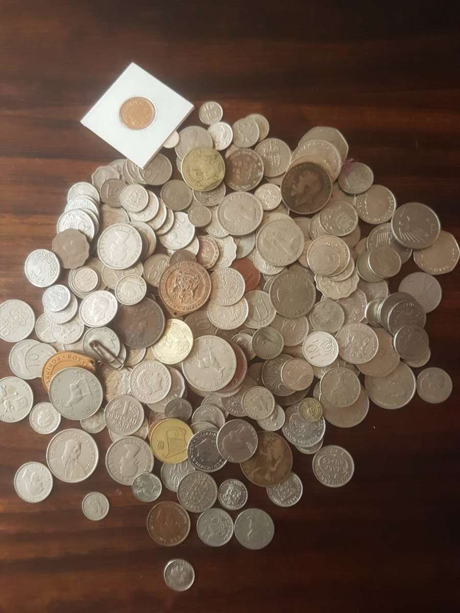 A HUGE LOT OF INTERNATIONAL COINS [One bid for the lot]