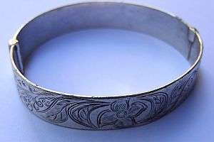 A VERY OLD HINGED SILVER BANGLE
