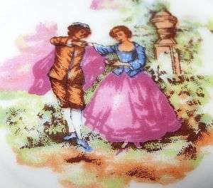 A WHITE AND GOLD PORCELAIN TEA SET WITH ROMANTIC MOTIF - 5 DUOS , TEAPOT , MILK JUG , SUGAR POT