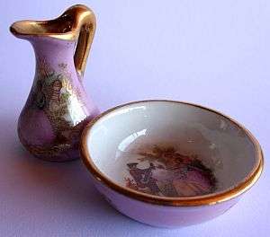 A Limoges ewer and basin with Fragonard decor