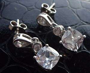 A PRETTY PAIR OF STERLING SILVER EARRINGS SET WITH FACETED CZ STONES