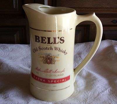 A WATER JUG ADVERTISING BELLS SCOTCH WHISKY
