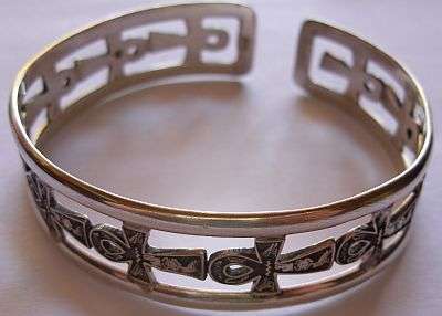 24 HR AUCTION !!! A SILVER CUFF BANGLE DECORATED WITH "ANCIENT" CROSSES , BETTER KNOWN AS ANKHS