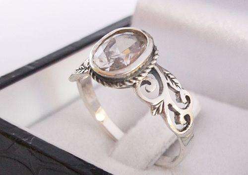 A VERY STYLISH STERLING SILVER RING SET WITH A FACETED CLEAR STONE !!! AWESOME FIND !!!