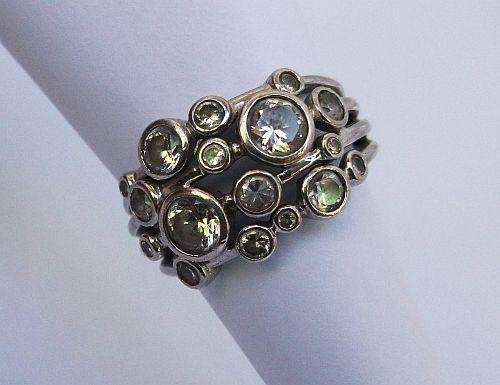 A SUPER BEAUTIFUL SOLID STERLING SILVER RING SET WITH FACETED CZ STONES !!! WOW X 1 000 000 !!!