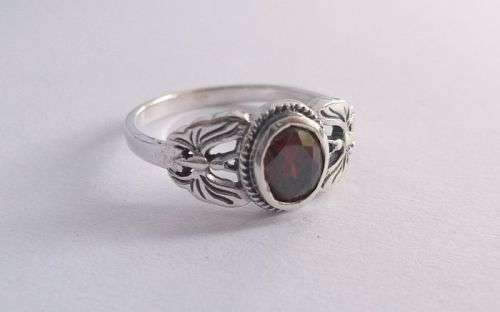A SENSATIONAL STERLING SILVER RING WITH BUTTERFLY DESIGN AND FACETED RED STONE ...WOW !!!!