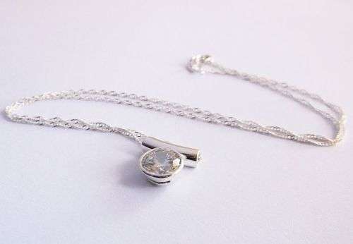 AN ELEGANT STERLING SILVER NECKLACE & STERLING SILVER PENDANT WITH FACETED STONE....DONT MISS OUT !!