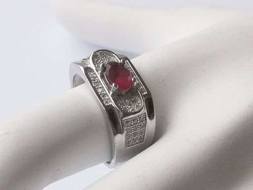 A GORGEOUS SOLID STERLING SILVER RING SET WITH TINY FACETED STONES AND FACETED RED CENTER STONE !!!