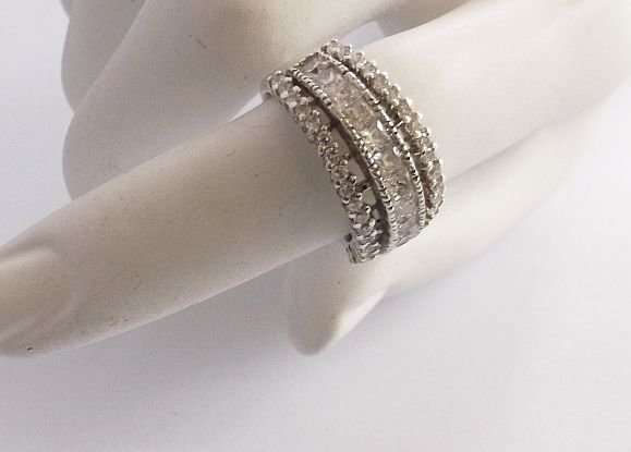 A BRILLIANT SOLID STERLING SILVER RING SET WITH MULTIPLE ROUND AND SQUARE FACETED STONES !! QUALITY