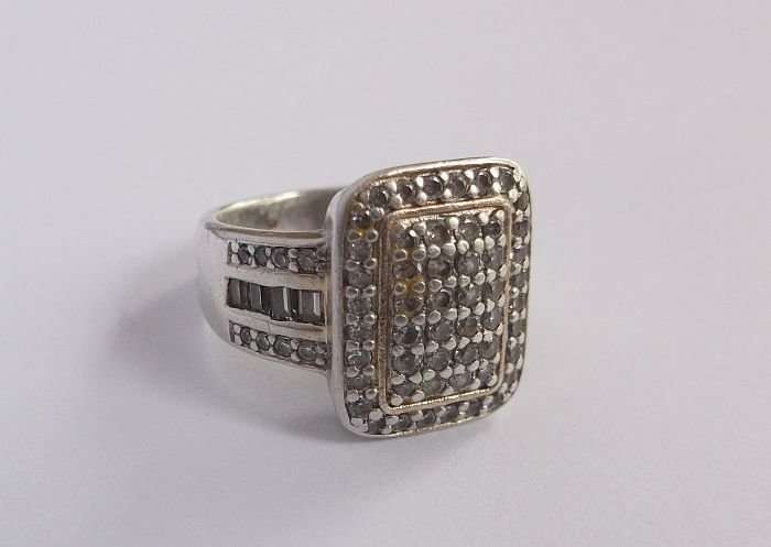 A GORGEOUS SOLID STERLING SILVER RING SET WITH VARIOUS FACETED STONES...MADE FOR AMERICAN SWISS !!!