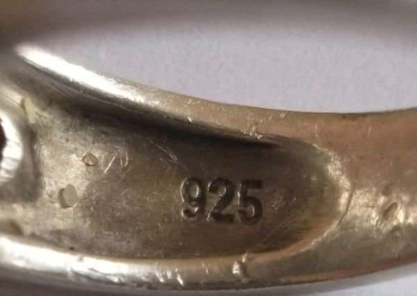 A GORGEOUS SOLID STERLING SILVER RING SET WITH VARIOUS FACETED STONES...MADE FOR AMERICAN SWISS !!!