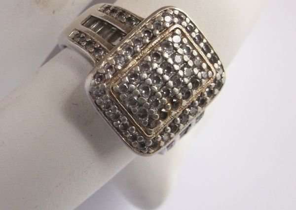 A GORGEOUS SOLID STERLING SILVER RING SET WITH VARIOUS FACETED STONES...MADE FOR AMERICAN SWISS !!!