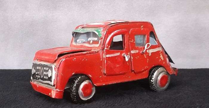 A VINTAGE HAND MADE TIN METAL CAR ORNAMENT ...OPENING DOORS AND BONNET ...AFRICAN ART