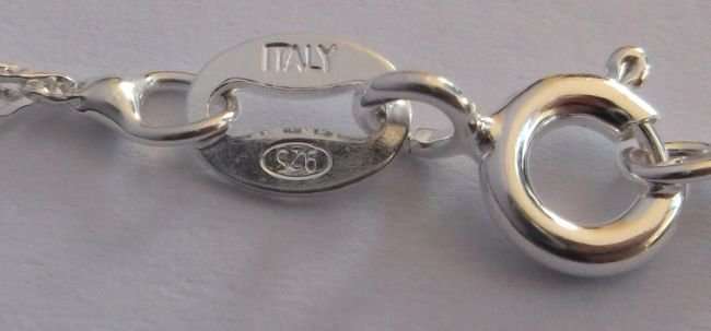 A STERLING SILVER NECKLACE PLUS A STERLING SILVER CROSS PENDANT