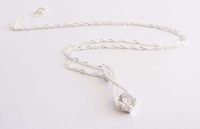 WOW !!!! A STERLING SILVER NECKLACE PLUS A STERLING SILVER PENDANT SET WITH A FACETED STONE