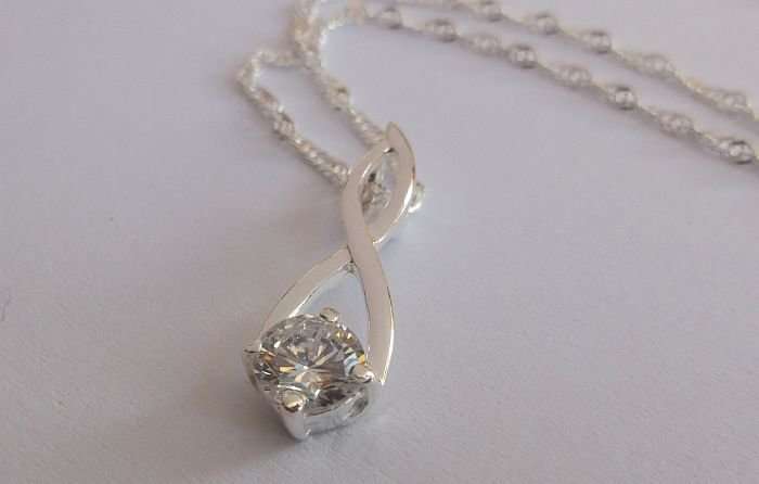 WOW !!!! A STERLING SILVER NECKLACE PLUS A STERLING SILVER PENDANT SET WITH A FACETED STONE