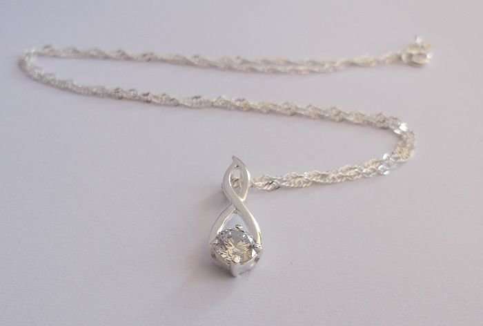WOW !!!! A STERLING SILVER NECKLACE PLUS A STERLING SILVER PENDANT SET WITH A FACETED STONE