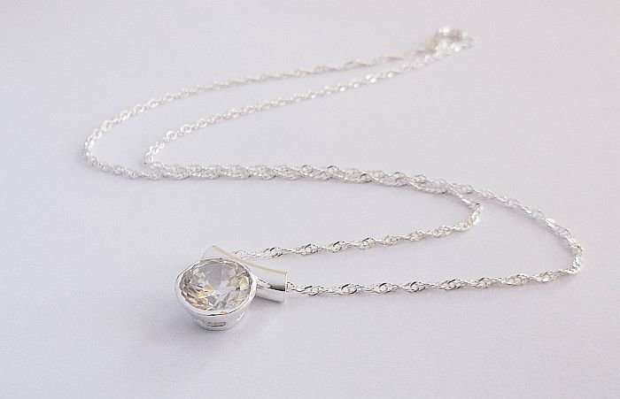 AN ELEGANT STERLING SILVER NECKLACE & STERLING SILVER PENDANT WITH FACETED STONE....DONT MISS OUT !!