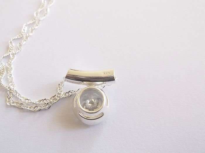 AN ELEGANT STERLING SILVER NECKLACE & STERLING SILVER PENDANT WITH FACETED STONE....DONT MISS OUT !!
