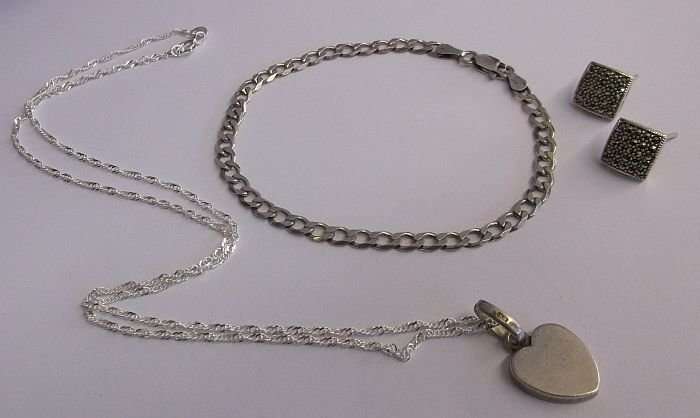 A QUALITY STERLING SILVER BRACELET..STERLING SILVER EARRINGS...STERLING SILVER NECKLACE AND PENDANT