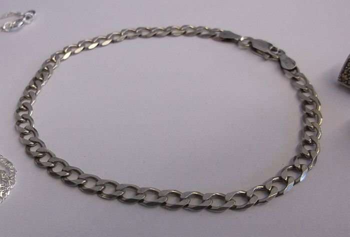 A QUALITY STERLING SILVER BRACELET..STERLING SILVER EARRINGS...STERLING SILVER NECKLACE AND PENDANT