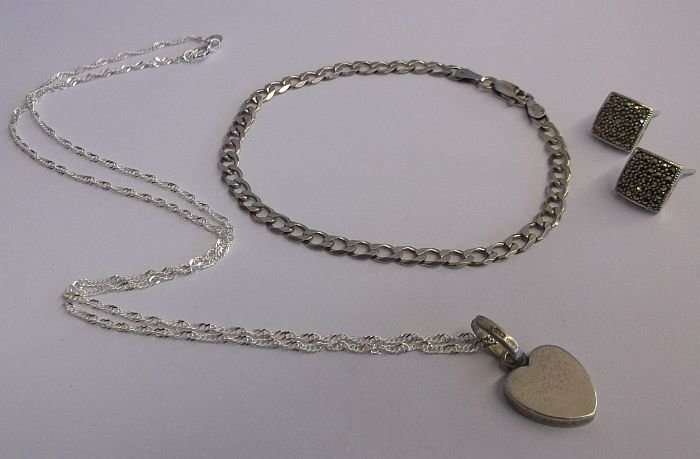 A QUALITY STERLING SILVER BRACELET..STERLING SILVER EARRINGS...STERLING SILVER NECKLACE AND PENDANT
