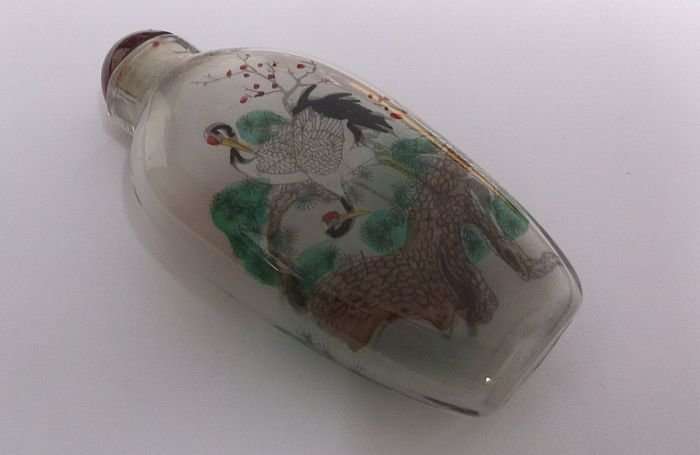 A BEAUTIFUL ORIENTAL GLASS SNUFF BOTTLE WITH WILD BIRD , WATERFALL AND BLOSSOMS DETAIL ....WOW !!