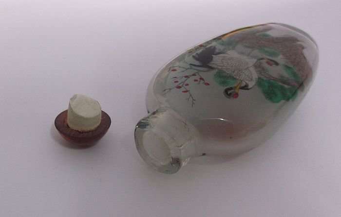 A BEAUTIFUL ORIENTAL GLASS SNUFF BOTTLE WITH WILD BIRD , WATERFALL AND BLOSSOMS DETAIL ....WOW !!