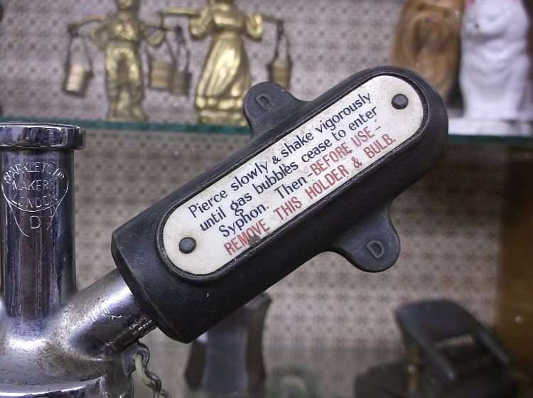 A MARVELOUS HEAVY QUALITY VINTAGE SODA SYPHON ....WITH A FEW GAS CAPSULES...MUST HAVE !!!!