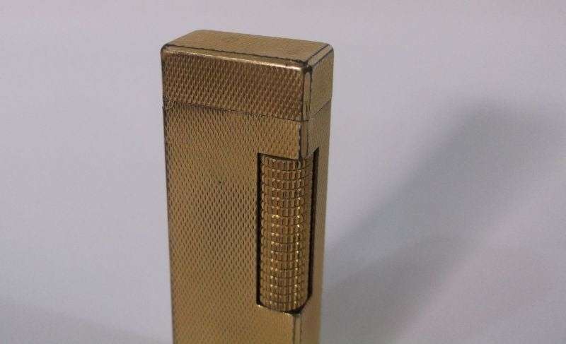 A totally Cool Vintage Swiss made gold plated lighter by Dunhill .....Sparking !!!!