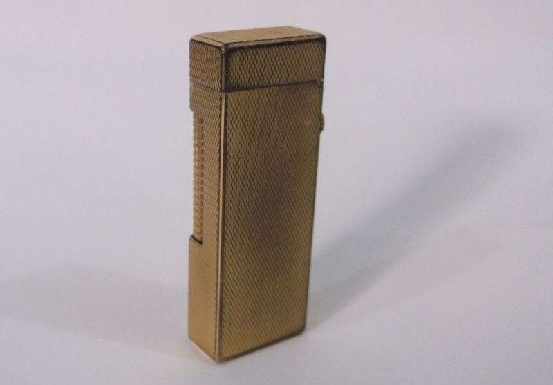 A totally Cool Vintage Swiss made gold plated lighter by Dunhill .....Sparking !!!!
