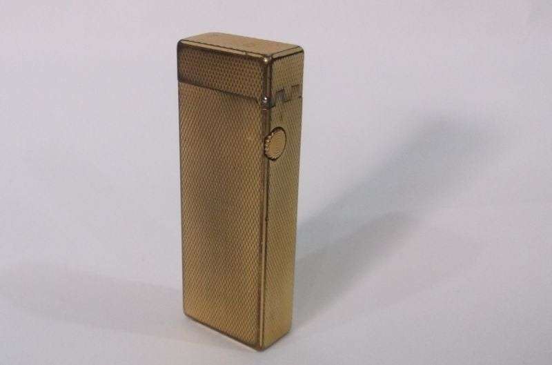 A totally Cool Vintage Swiss made gold plated lighter by Dunhill .....Sparking !!!!