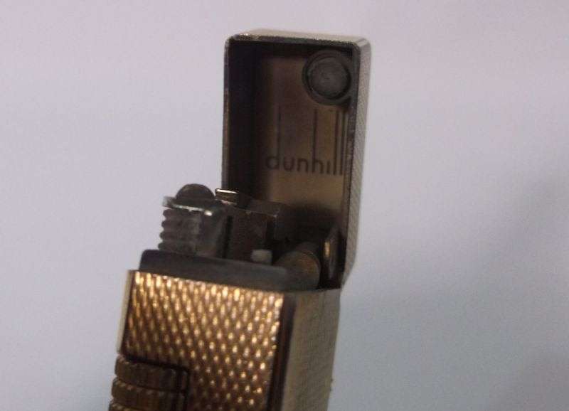 A totally Cool Vintage Swiss made gold plated lighter by Dunhill .....Sparking !!!!