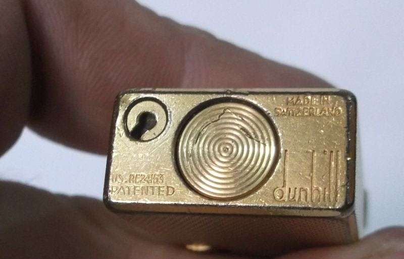 A totally Cool Vintage Swiss made gold plated lighter by Dunhill .....Sparking !!!!