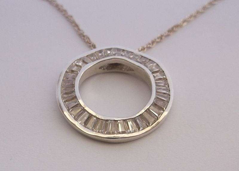 An Elegant solid Sterling Silver pendant set with 32 faceted Baguette cut stones ....WOW !!!!!