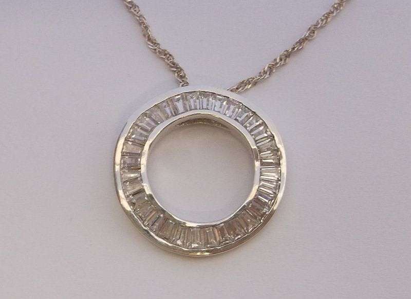 An Elegant solid Sterling Silver pendant set with 32 faceted Baguette cut stones ....WOW !!!!!