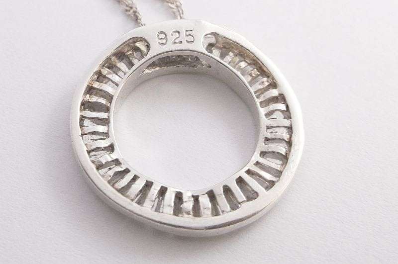 An Elegant solid Sterling Silver pendant set with 32 faceted Baguette cut stones ....WOW !!!!!