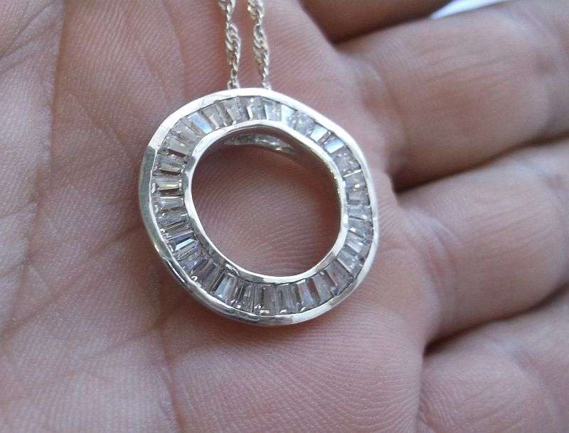 An Elegant solid Sterling Silver pendant set with 32 faceted Baguette cut stones ....WOW !!!!!