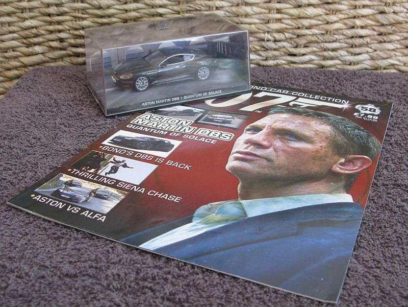 A 1:43 SCALE DIE CAST METAL MODEL OF THE ""ASTON MARTIN DBS"" AS SEEN IN THE JAMES BOND MOVIE