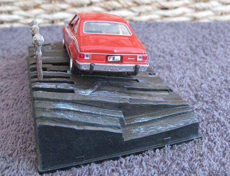 A 1:43 SCALE DIE CAST METAL MODEL OF THE ""AMC HORNET"" AS SEEN IN THE JAMES BOND MOVIE