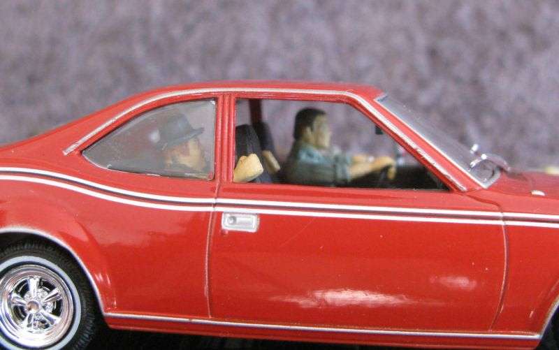 A 1:43 SCALE DIE CAST METAL MODEL OF THE ""AMC HORNET"" AS SEEN IN THE JAMES BOND MOVIE