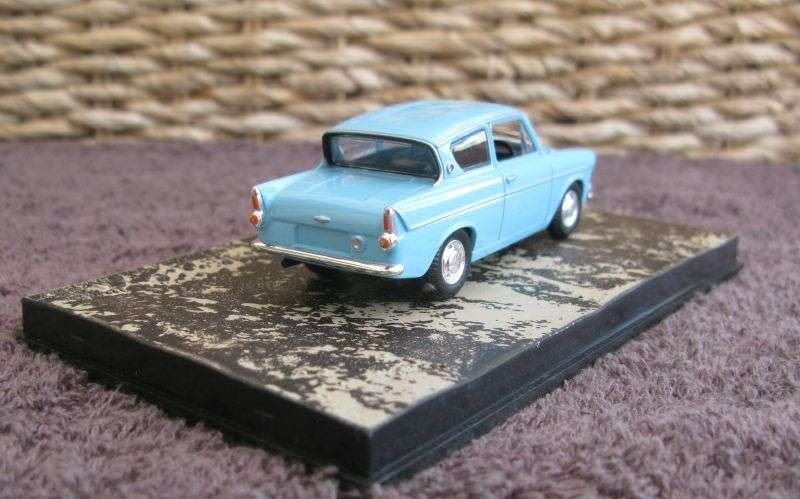 A 1:43 SCALE DIE CAST METAL MODEL OF THE ""FORD ANGLIA"" AS SEEN IN THE JAMES BOND MOVIE