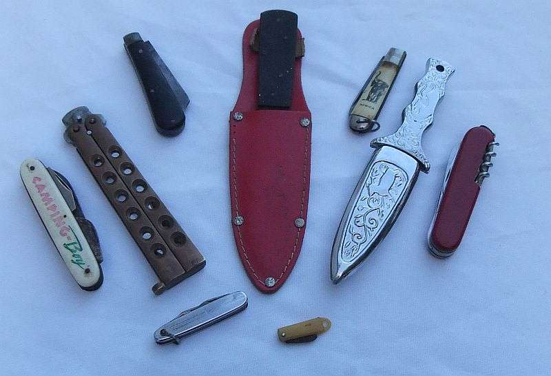 A COLLECTION OF SHARP OBJECTS...THROWING KNIFE ..BUTTERFLY KNIFE...DAGGER...RODGERS...ALL HERE !!!!