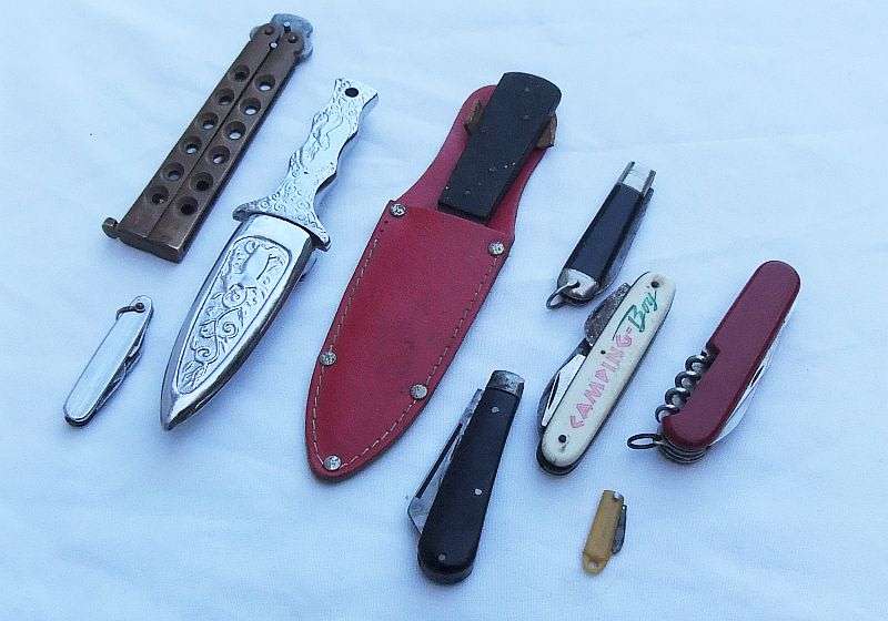 A COLLECTION OF SHARP OBJECTS...THROWING KNIFE ..BUTTERFLY KNIFE...DAGGER...RODGERS...ALL HERE !!!!