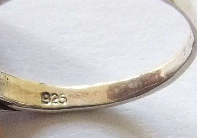 A Fancy Solid Sterling Silver ring set with a red faceted Cubic Zirconia !! No Combining Fees !!