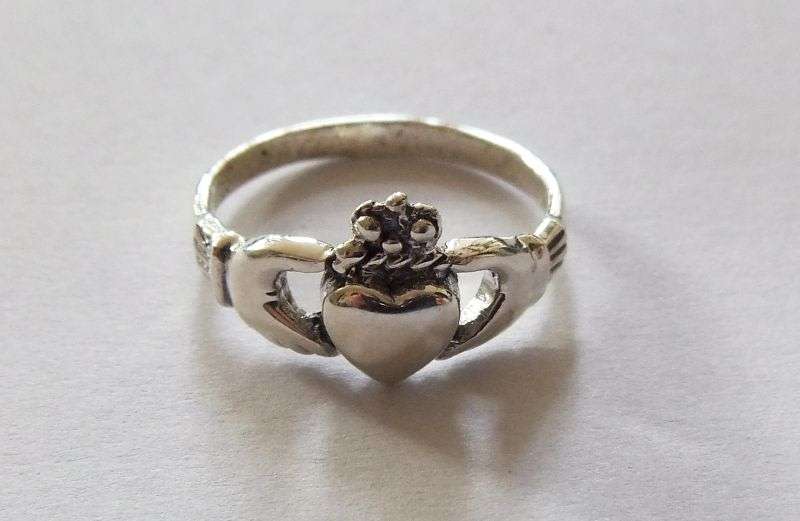 A Super cool Solid Sterling Silver Claddagh ring representing Love , Friendship and Loyalty !! WoW