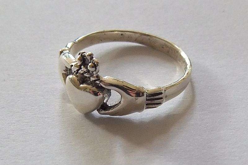 A Super cool Solid Sterling Silver Claddagh ring representing Love , Friendship and Loyalty !! WoW