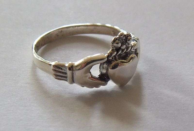 A Super cool Solid Sterling Silver Claddagh ring representing Love , Friendship and Loyalty !! WoW