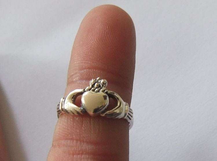 A Super cool Solid Sterling Silver Claddagh ring representing Love , Friendship and Loyalty !! WoW